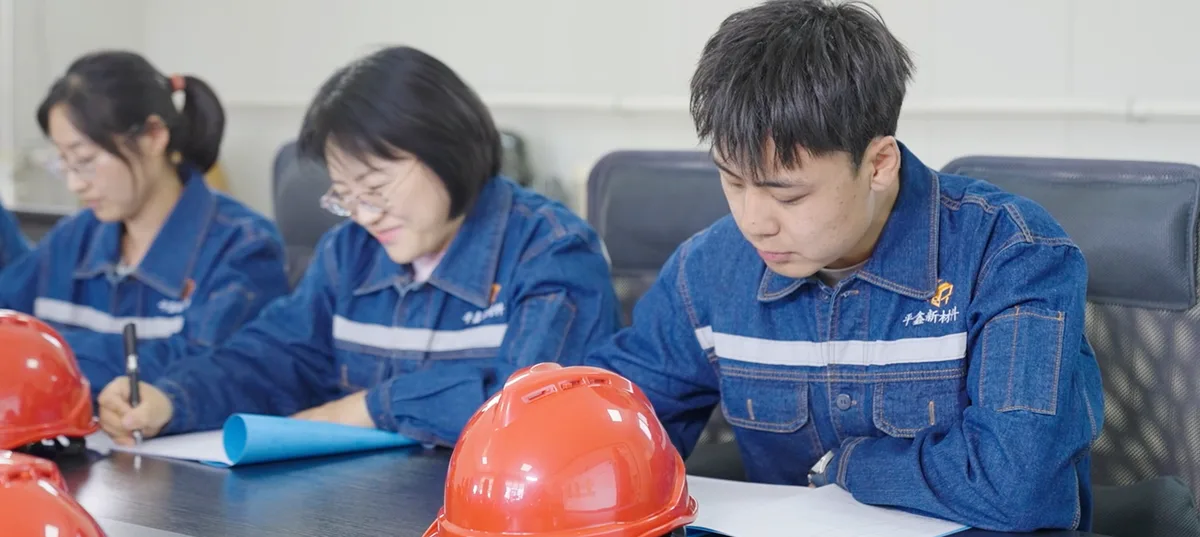 Staff taking notes during technical training